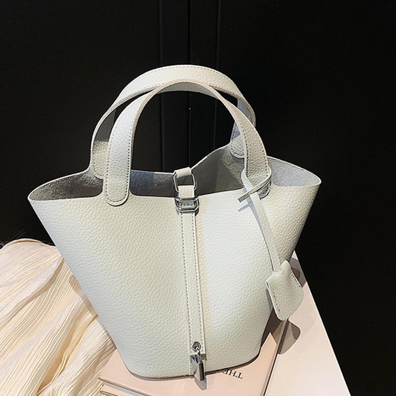 Niche fashion design bag women's 2025 new popular simple hand bag foreign style portable vegetable basket bucket bag