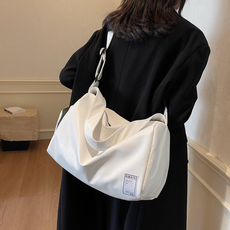 Damenstil Achsel-Reisetaschen für Reisen Französische Einfache Gepäcktaschen Trocken- und Nass-Trennung PU Kann für Ziehstange verwendet werden Fitnesstaschen