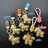Chaveiro Minimalista Moderno e Pingente para Cordão de Celular em Ouro Puro 999 para Casal