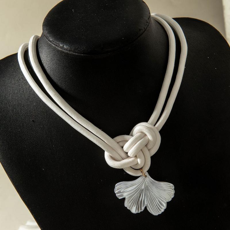 A Unique Knotted Design Necklace With Leaves Starfish And Scallops A Simple Drawstring Pendant Necklace With A Bow And Pearls