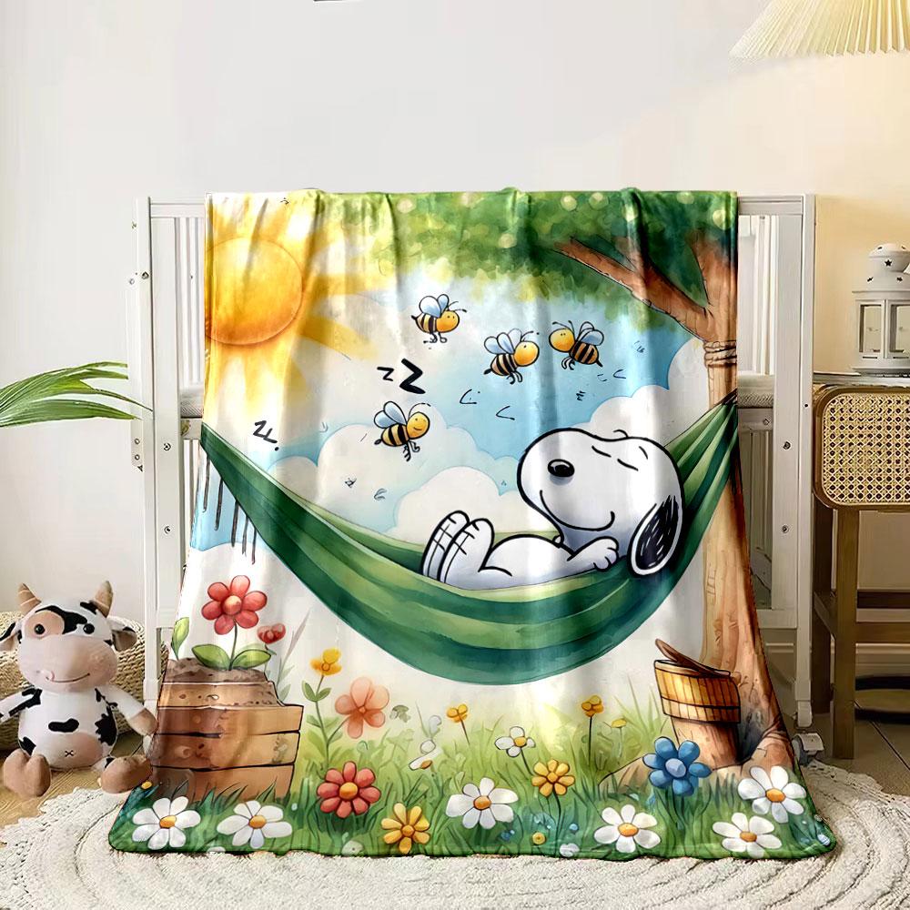 

A character sleeps in a hammock surrounded by bees and flowers. for all seasons blanket lunch break throw gift 80cm x 120cm
