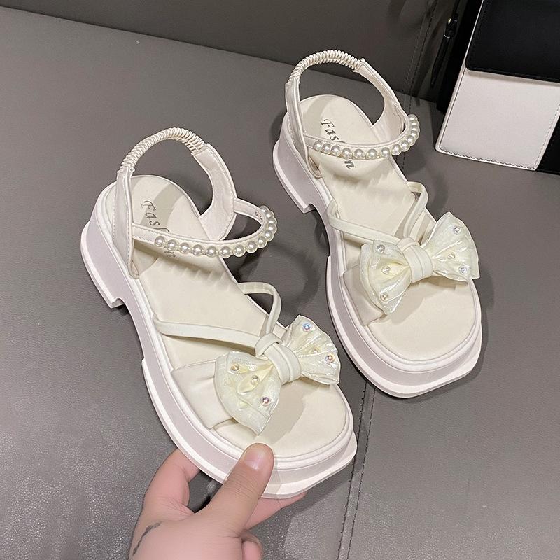 

High-heeled sandals women s 2025 new summer bow fairy wind platform pearl one-word belt fashion Roman women s shoes 35 бежевый