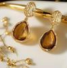 Vintage Amber Water Drop Earrings for Women - Retro Hong Kong Style, Elegant Studs, Light Luxury Fashion.