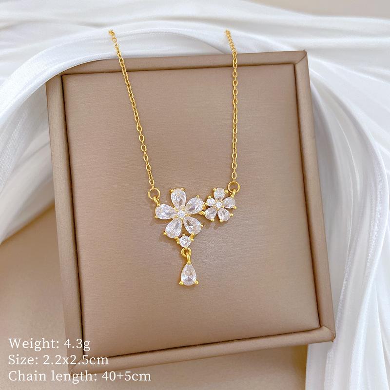 

Циркон Пятилистный цветок Легкая роскошь Темперамент Великолепное Полностью бриллиантовое ожерелье Женская Универсальная цепочка на ключицу Цепочка из титановой стали