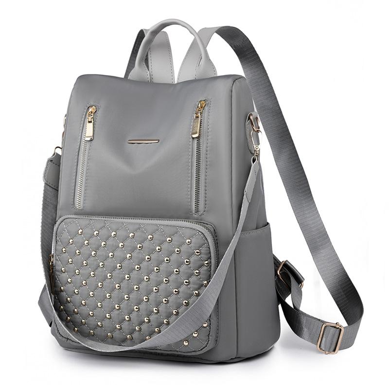 Nylon backpack women s bag new large capacity rivet women s backpack mommy bag trendy student schoolbag серый