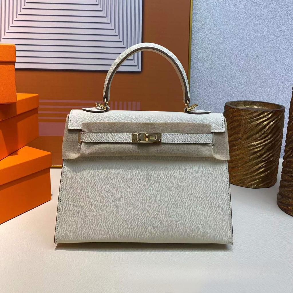 Grenzüberschreitende Hersteller Großhandel Damenhandtaschen 2023 neue Handtaschen aus Leder mit Palmenmuster tragbare Schulter-Umhängetaschen Damenhandtaschen große Kapazität