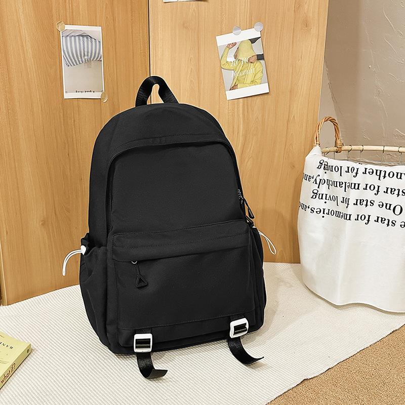 Schoolbag1011 new versatile black schoolbag male college student large capacity backpack female junior high school girl solid color backpack
