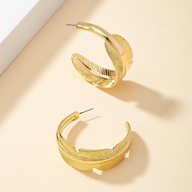 

Geometric C-shaped Leaf Texture Earrings - Minimalist Design Women s Studs