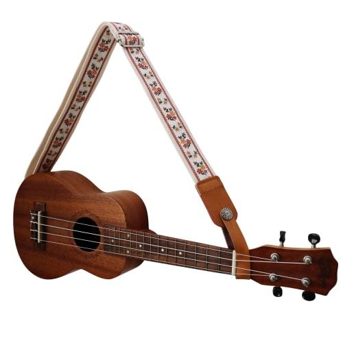 This is a genuine leather ukulele strap with a vintage floral embroidery, an original design by MUSIC FIRST. It is a ukulele shoulder strap with a gen