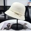 French romantic white rich women's golden wind top hat autumn and winter high-end Hepburn wind pure wool woolen small brim basin hat