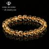 Jingdong Schmuck Unisex Armband mit runden Perlen: 7A Blitzgelber Tigerauge-Stein