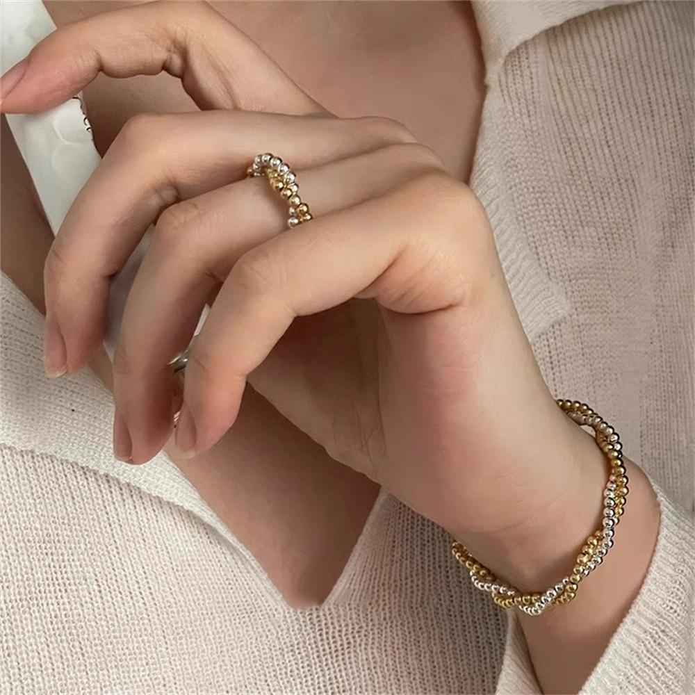 Gold and silver contrasting color round bead interwoven ring cold wind niche temperament light luxury simple elastic rope ring