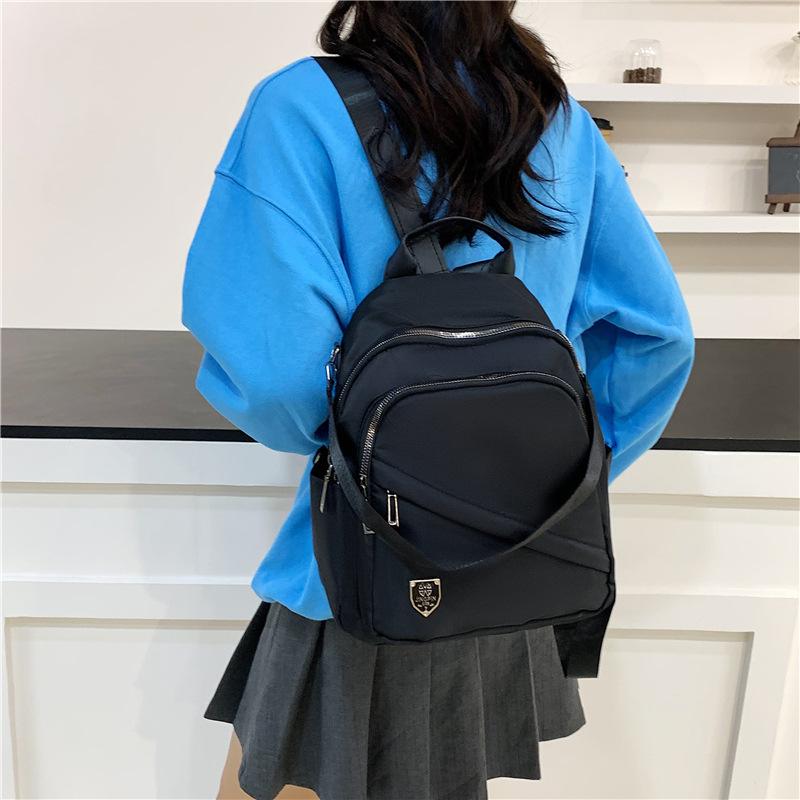 Schoolbag Simple temperament Casual backpack Multi-pocket large capacity Lightweight backpack Fashion versatile shoulder messenger bag