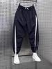 Men's Stylish Ice Silk Quick-Dry Harem Pants - Spliced, Fashionable, Versatile, and Trendy for Spring and Summer.