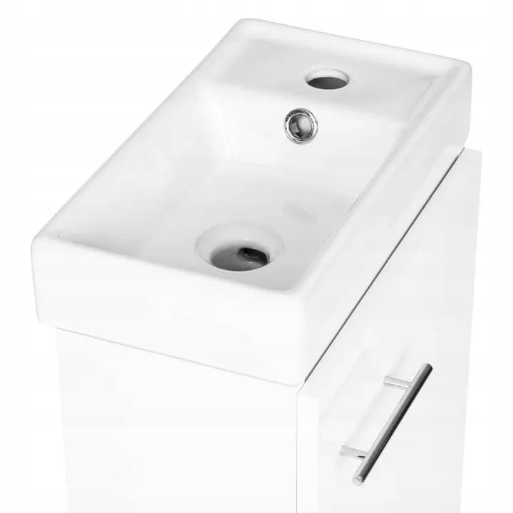 Badezimmerschrank mit einem weiß glänzenden wandhängenden Waschbecken 50x70 Klein und einem länglichen Chromhahn