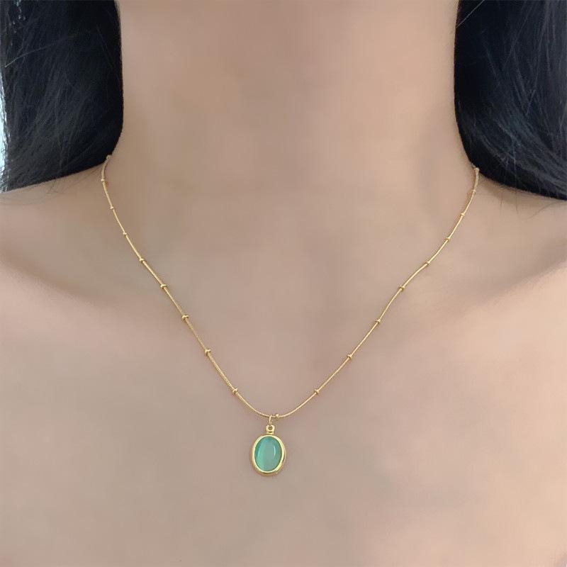 Lake Green Cat's Eye Necklace: Women's Simple Titanium Steel Clavicle Chain with Oval Stone and Freshwater Pearl Combination