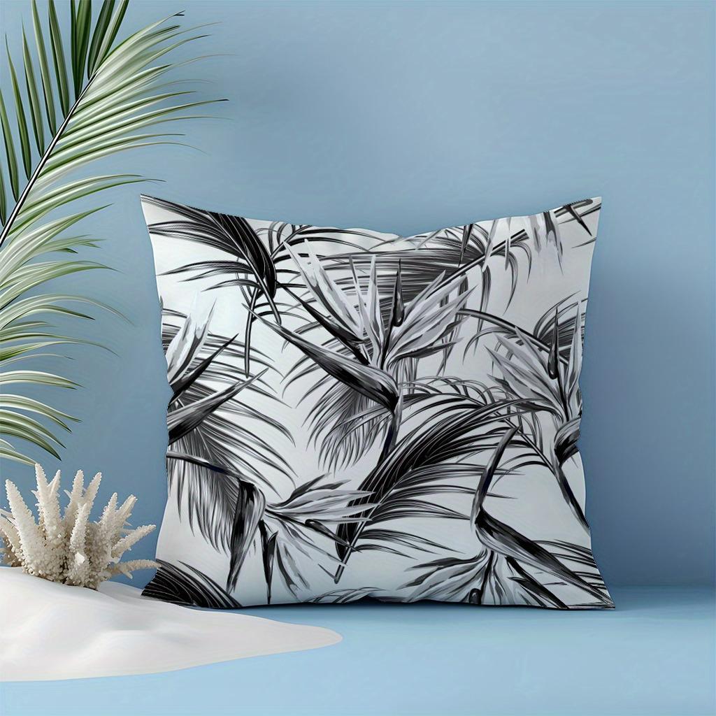 Black and white leaf print throw pillowcase, machine washable polyester material, suitable for living room and bedroom decor.