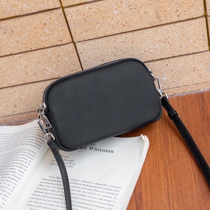 

The first layer of cowhide women s bag, shoulder messenger bag, simple multi-compartment zipper square bag, soft leather change mobile phone bag. чёрный