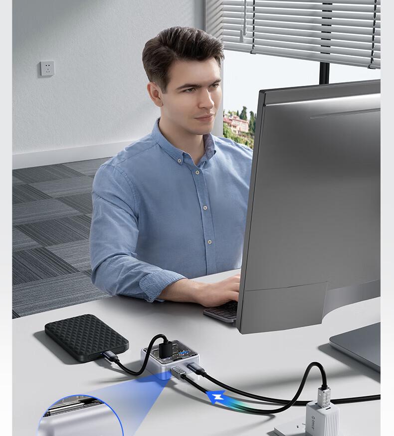Orico MH4UC Multi-Port Fast Charging Hub with Direct Plug-In and U Disk Compatibility for Desktop, Notebook, and Tablet TC Port.