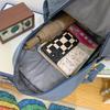 Schoolbag wholesale Korean version of casual large-capacity backpack, junior high school student schoolbag, solid color multi-layer Harajuku backpack 
