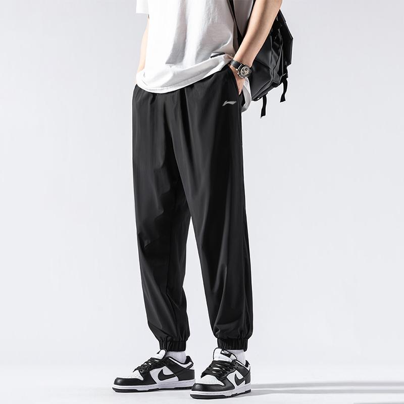 Li-Ning Jednobarevné s potiskem loga Rychleschnoucí Pletené Joggers Pánské Spodky Černé AYKT415-1