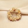 Red round brooch female high-end female corsage pin pearl suit light luxury niche light luxury simple accessories suit