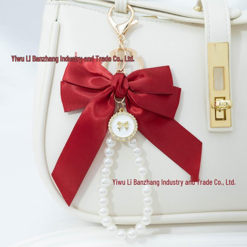 Large Bow Faux Pearl Bracelet Keychain with Colored Woven Strap and Alloy Tag Pendant