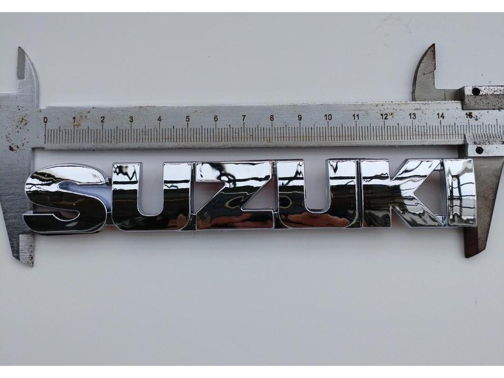 Suzuki S Logo Badge - Original Hollow Front Grille Emblem