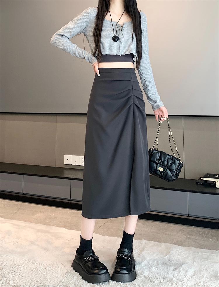 Dámská midi sukně áčkového střihu s vysokým pasem a rozparkem pro raný podzim 2025