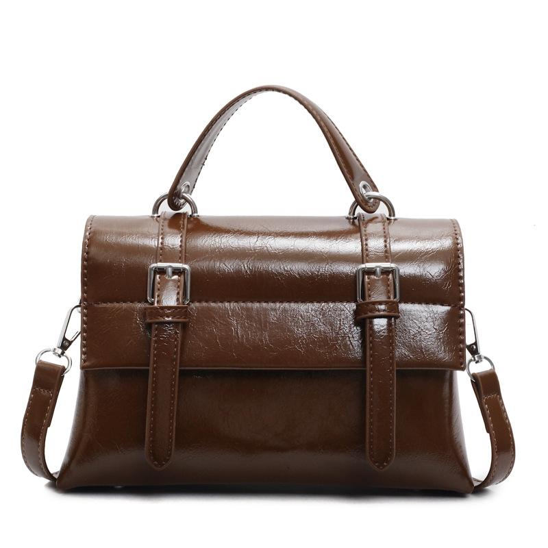 

Early spring new retro simple color college style portable messenger bag high sense fashion versatile commuter messenger women s bag темно-коричневого
