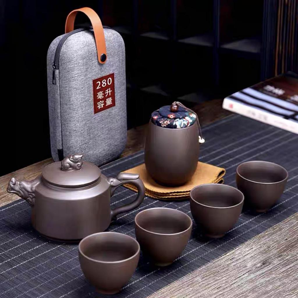 Zisha Travel Tea Set: Portable Xishi Pot with Quick-Brew Cup and Four Cups - Perfect for Outdoor or Home Tea Ceremonies.