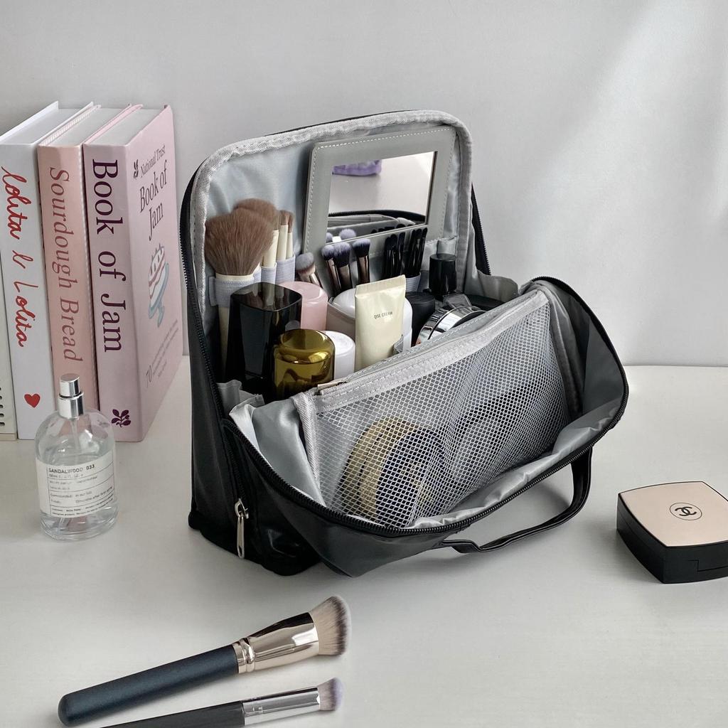 Portable Large Capacity Makeup Bag with Mirror, Hangable on Suitcase, Compartmentalized Cosmetic Storage Pouch.
