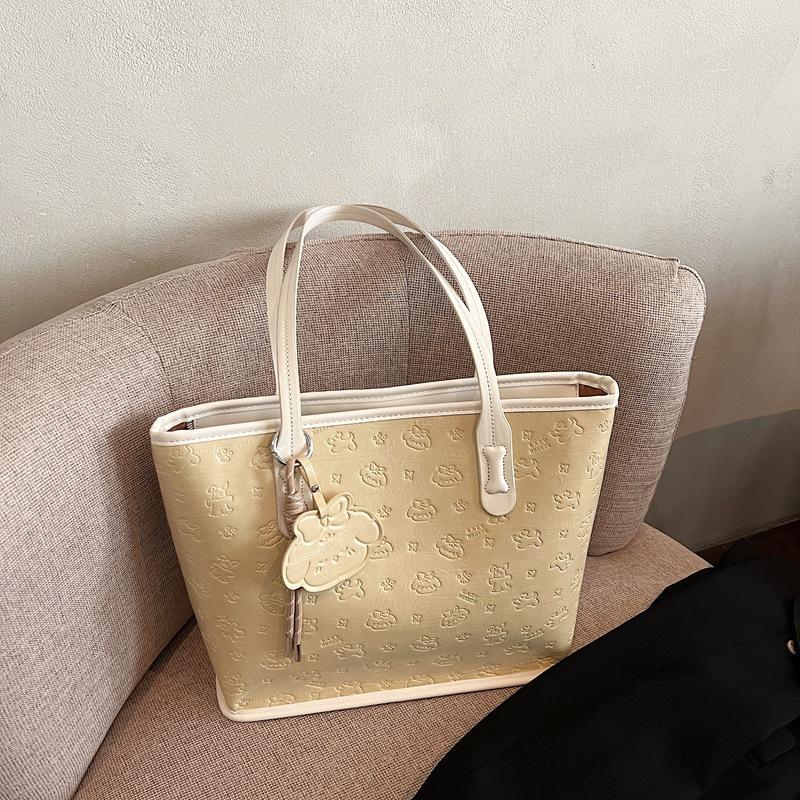 Casual large-capacity tote bag women's bag new niche embossed commuter shoulder oblique span bag bucket bag