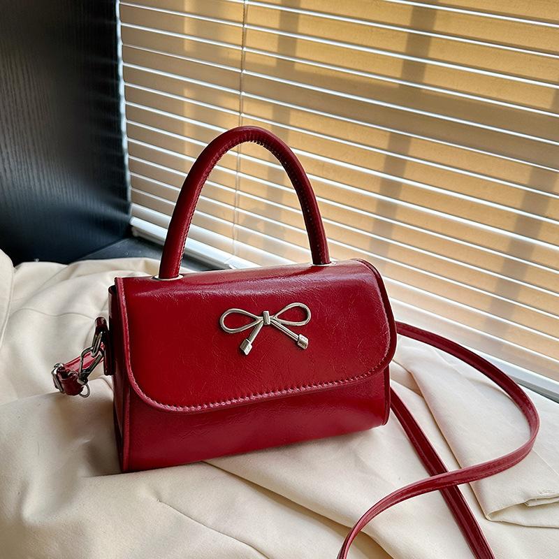 2025 simple solid color bow sewing line less fashionable casual oblique span single shoulder portable small square women's bag