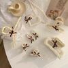 Pearl love bow hairpin rice bead weaving beige series grab clip literary light luxury hair accessories