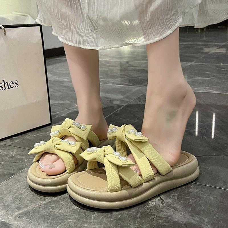 thick-soled pearl slippers for women to wear in the summer of 2025, the new fairy style fashion bow muffin open-toed sandals