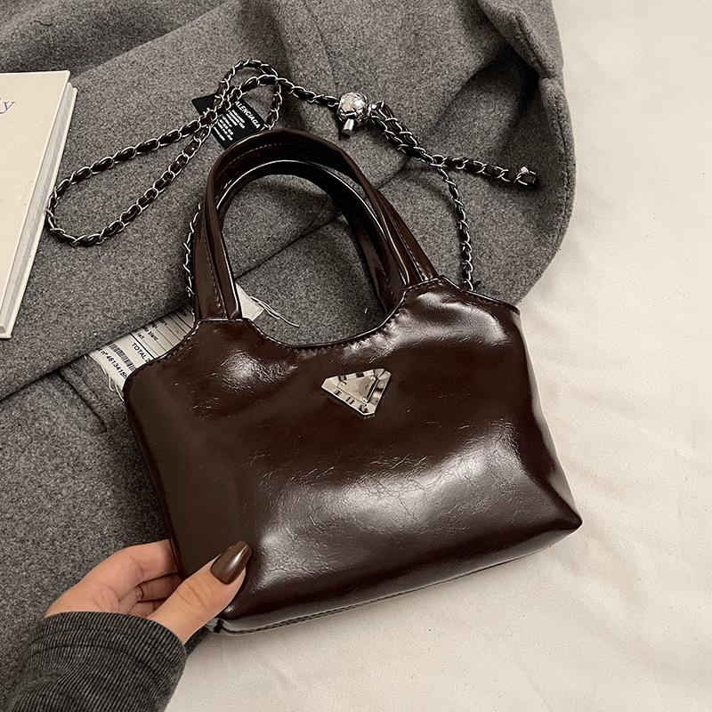 

Оптовая горячая распродажа корейская модная портативная сумка-ведро из масляной вощеной кожи для通勤, универсальная, нишевый дизайн, женская сумка-мессенджер