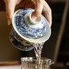 140ml Chiński Niebiesko-Biały Porcelanowy Gaiwan Filiżanka do herbaty Ręcznie malowana Ceramiczna Miseczka na herbatę Domowa Miseczka na herbatę Przenośne Naczynia do herbaty