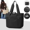 Women's portable folding storage bag with multiple compartments and adjustable shoulder strap for large capacity.