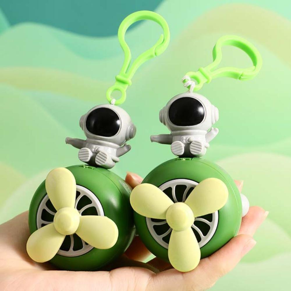 Kousání zubů dinosaurus hračka klíčenka nádherný rotující vrtulník přívěsek astronaut klíčenka dárky