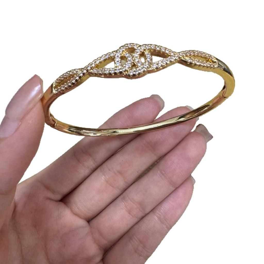 Women's Gold-Plated Copper Bracelet with Rhinestones and Twisted Knot Design