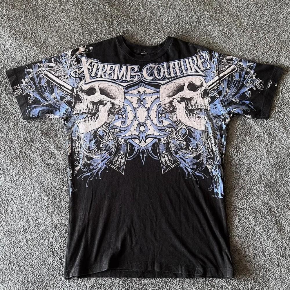 Moda estiva uomo europea e americana stampa teschio con lettere T-shirt comoda e traspirante con scollo rotondo top da esterno per strada