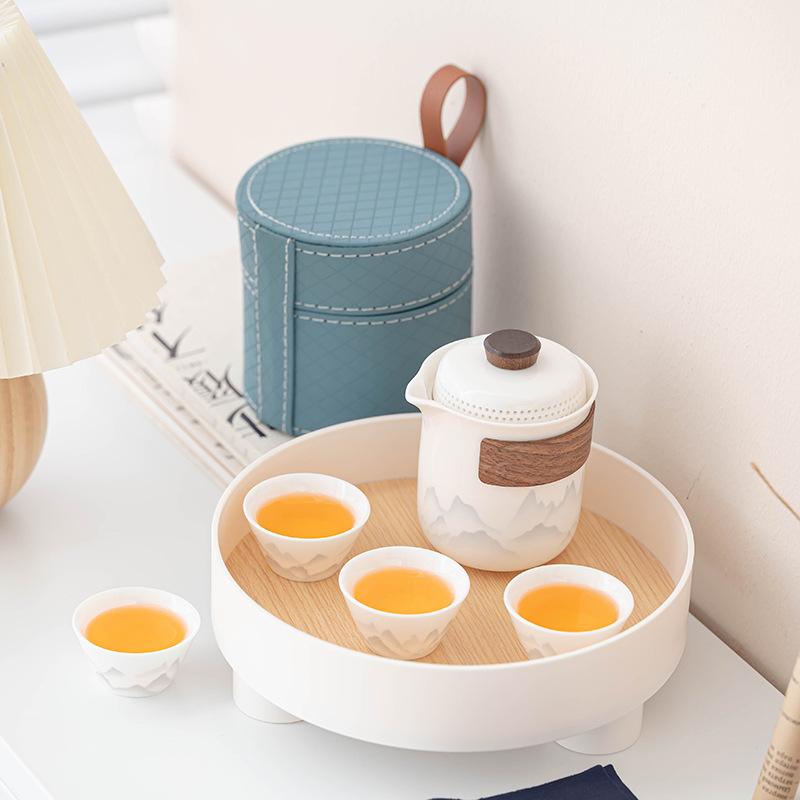 Flower travel tea set, light luxury and portable, one pot and four cups of Ru kiln car business gifts
