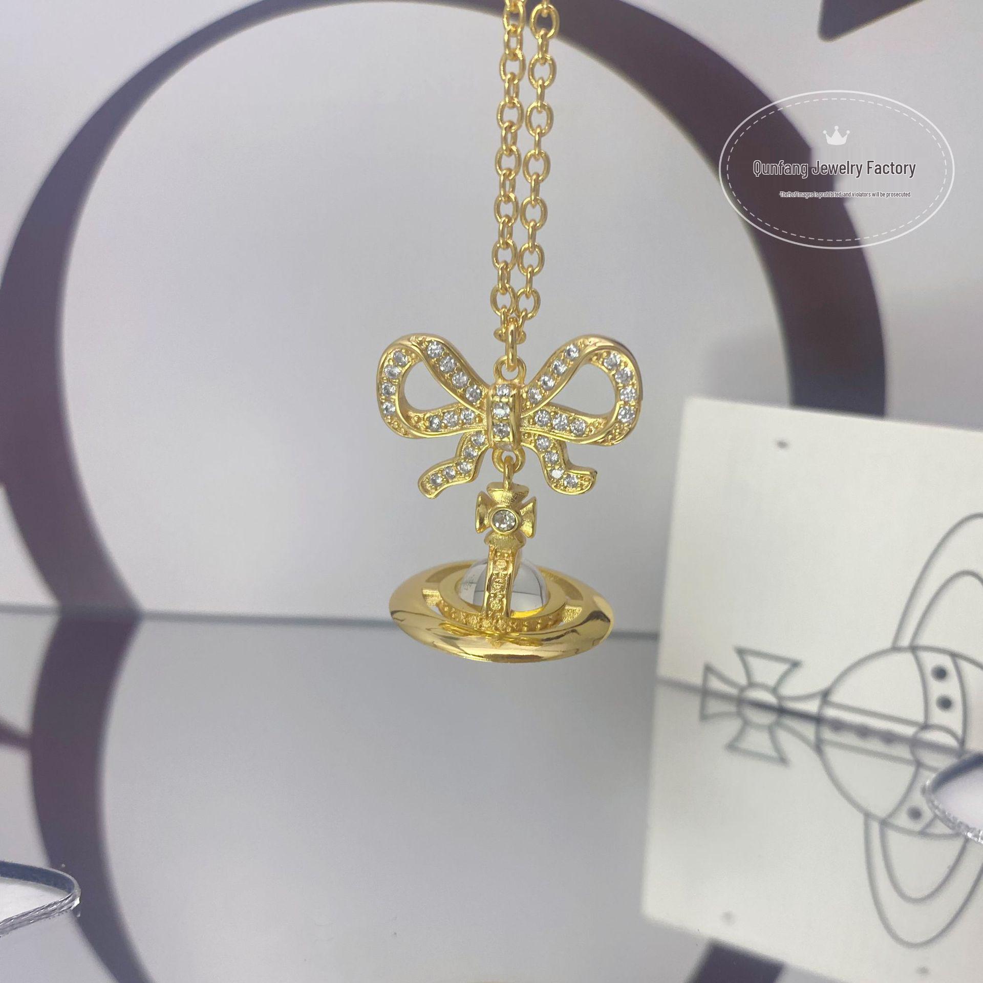 

Ожерелье Vivienne Westwood с розовым бантом и сферой: Женская высококачественная 3D цепочка на ключицу с кулоном в виде Сатурна и баскетбольного мяча.