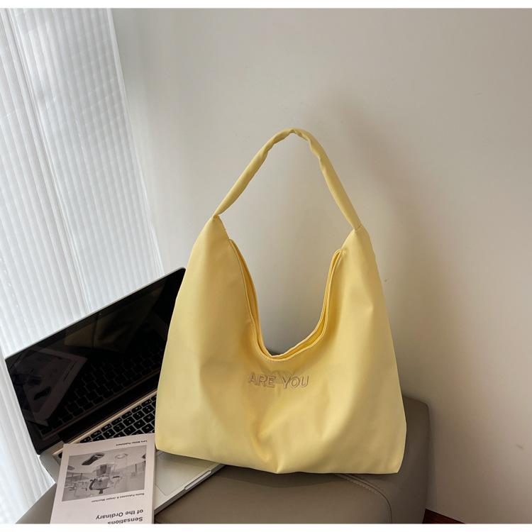 

Large-capacity tote bag women s Korean niche simple letter shoulder bag to work commuter bag new armpit bag жёлтый