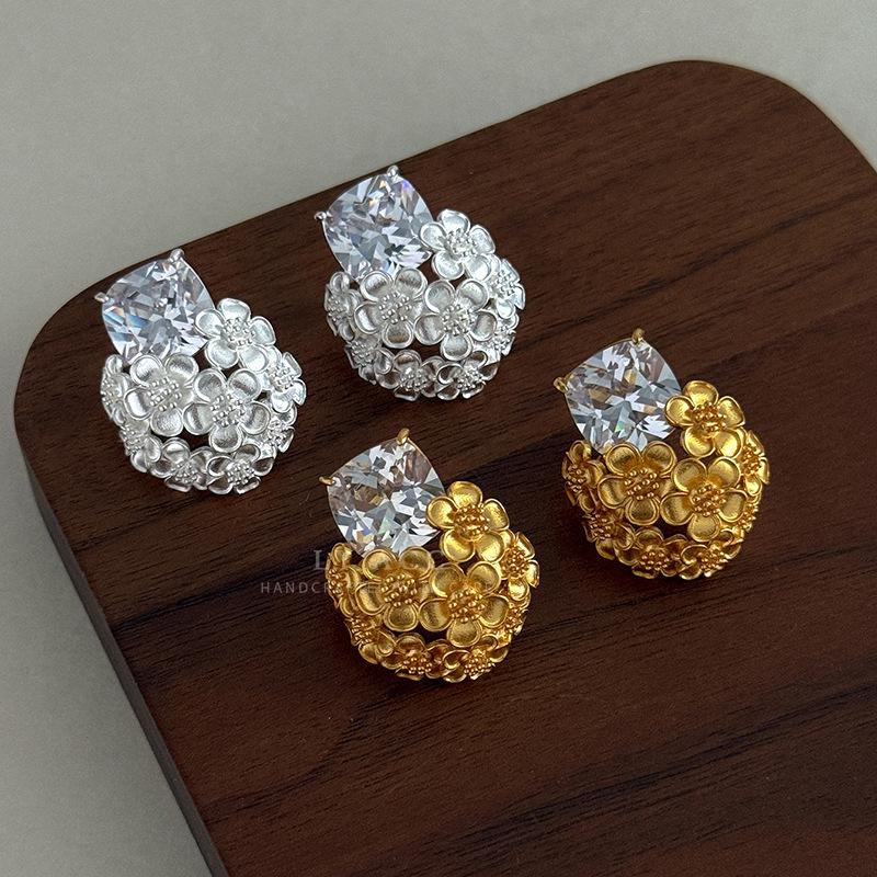 Gold and silver series zircon stud earrings two-color gold and silver hollow relief earrings light luxury cold shining versatile ears
