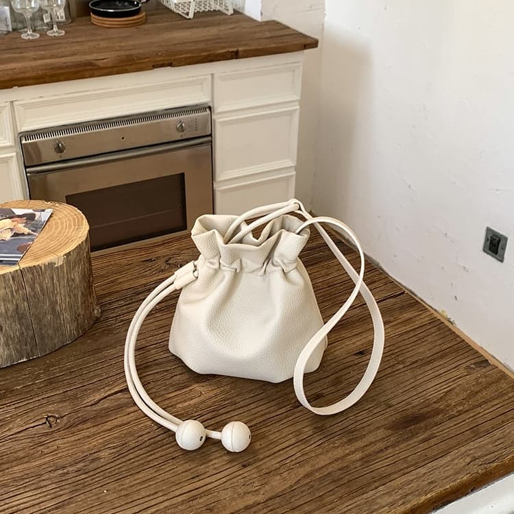 

Soft leather drawstring mini bucket bag women s shoulder bag бежевий
