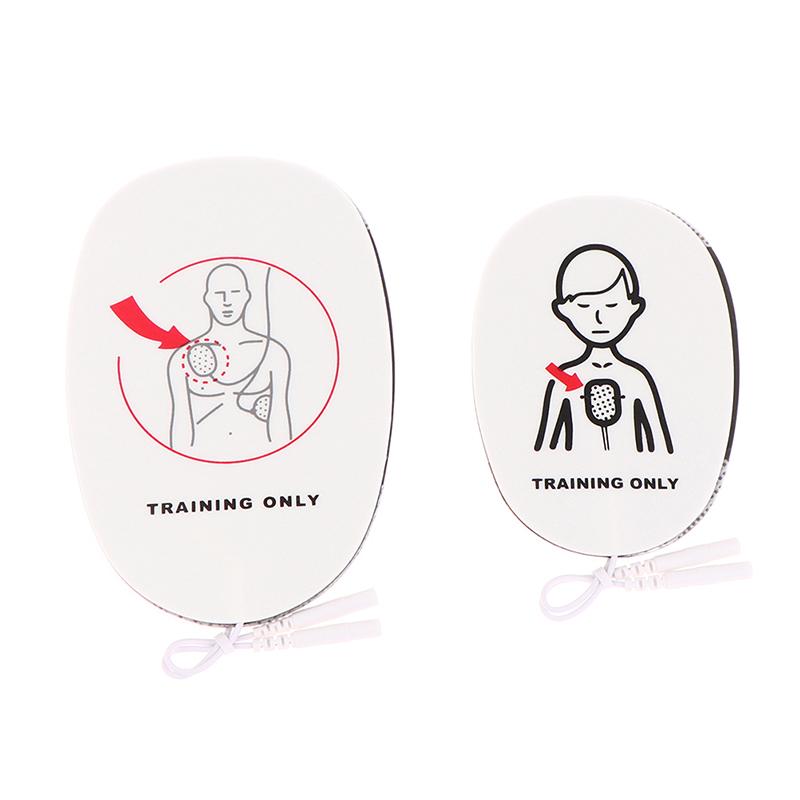 

1 пара накладок для тренировочного устройства AED, для тренировок по оказанию первой помощи, сменные подушечки, для взрослых и детей, универсальный тренажер