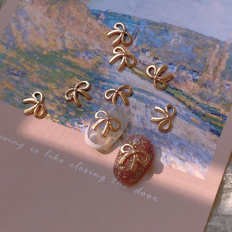 5 Stuks/Zak Elegante Legering Strik Nagel Charms 3D Metaal Zilver Goud Champagne Goud Licht Luxe Holle Strik Super Fee Nagellak Accessoire