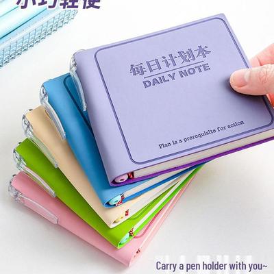 Taschengroßer Tagesplaner mit Kugelschreiber - Kompaktes und stilvolles Notizbuch für Zeitmanagement